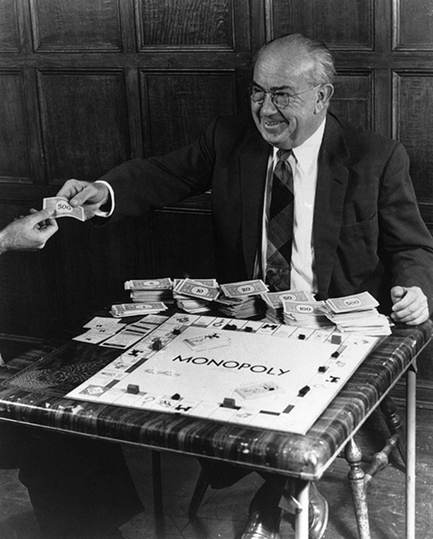 Charles B. Darrow, inventor of the game of Monopoly, is pictured enjoying his game, Jan. 1958. (AP Photo)